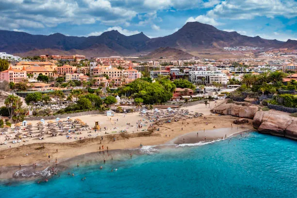Golden beach and white resort hotels in Costa Adeje, Tenerife